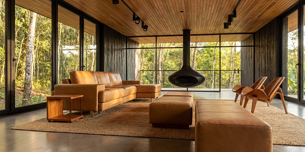 Output: Living room with floor-to-ceiling glazing and a suspended fireplace