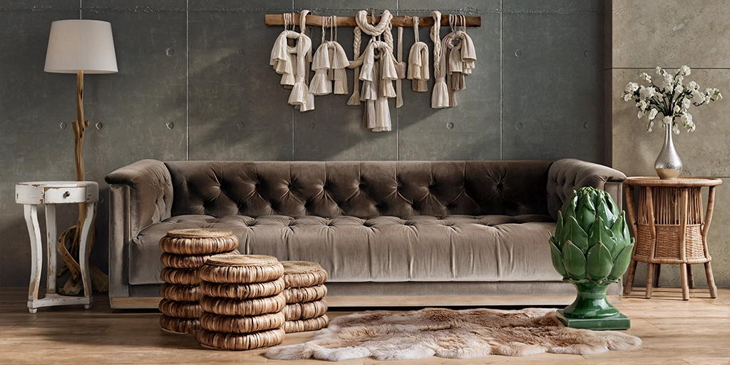 Output: Tufted sofa with woven stools and a green decorative object