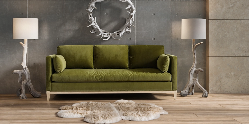 Output: Green sofa between sculptural floor lamps against a concrete wall